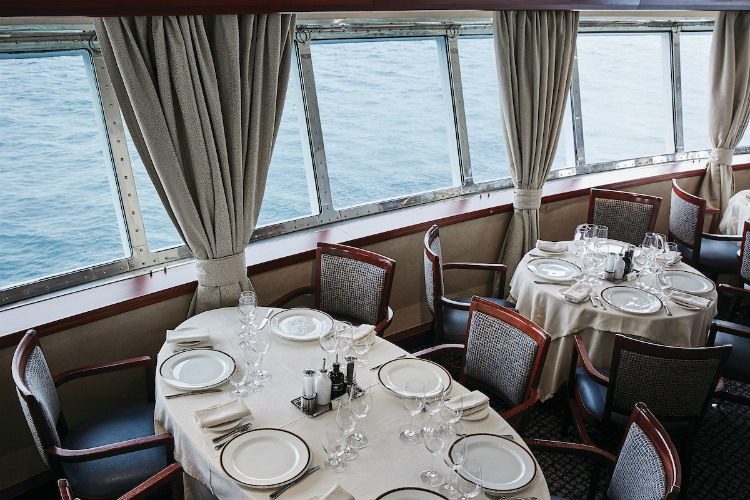 Tables in the sophisticated restaurant on-board Silver Explorer