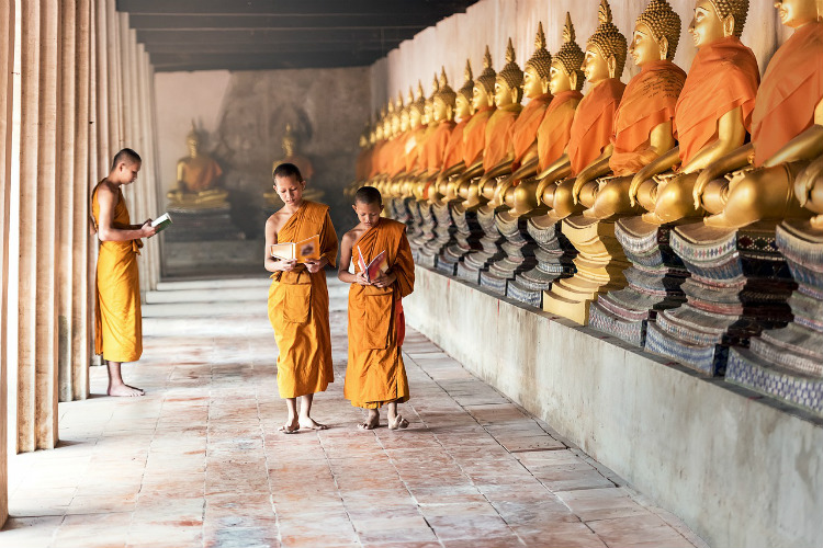 Buddhist priests in a temple in Rangoon in Myanmar