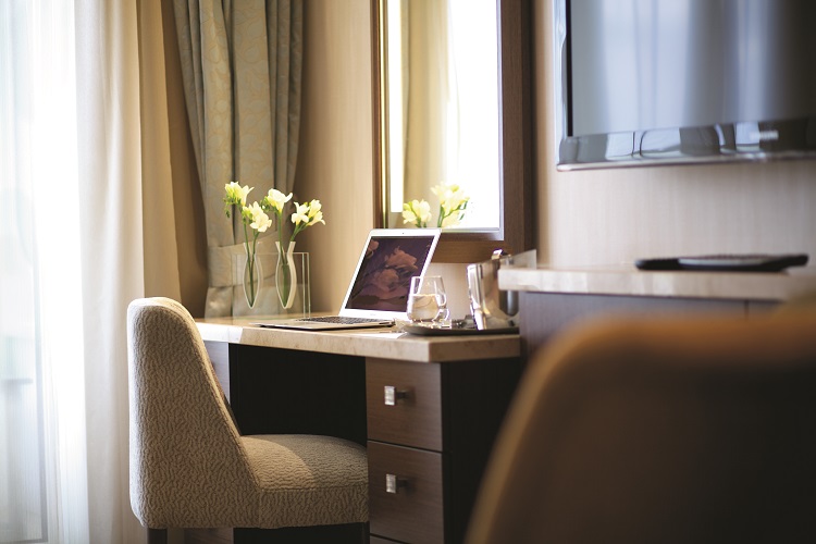 The elegant desk area in a suite on-board Celebrity Eclipse