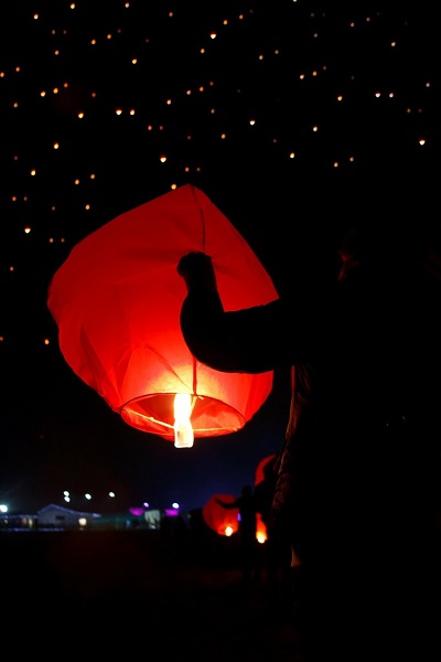 Local person holding a Chinese lantern during Chinese New Year celebrations