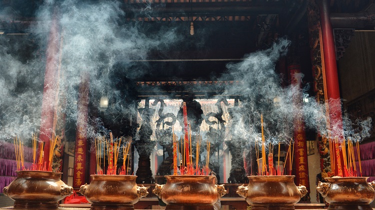 Incense burning outside an ancient temple in Vietnam