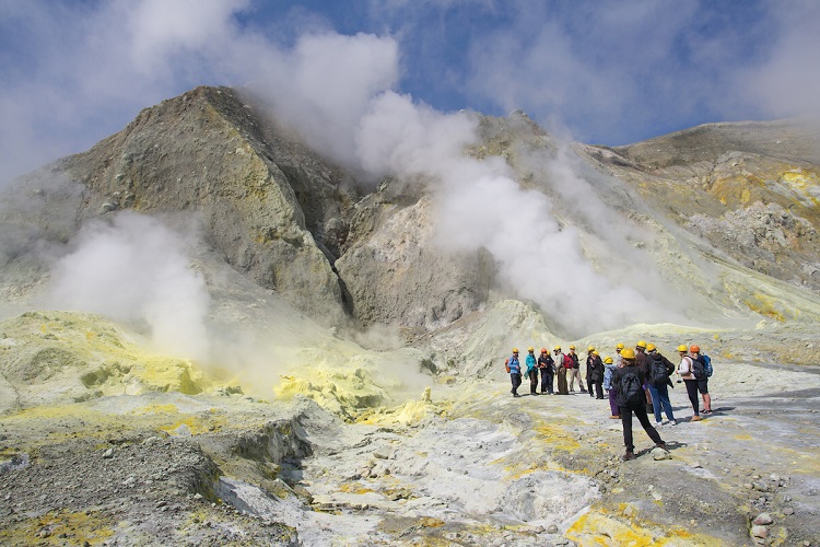 Silversea expedition guests exploring a geothermal landscape in the Bay of Islands in New Zealand