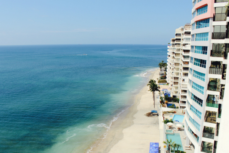 A hotel complex lining a beach in Miami cruise port