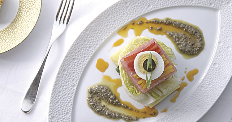 A plate of gourmet food in the Chartreuse restaurant on a Regent Seven Seas cruise