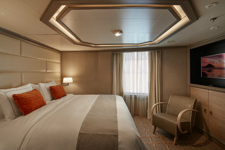 The luxurious bedroom in a Royal Suite on-board Silver Muse
