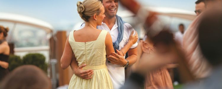 Couple dancing on-board Celebrity Cruises