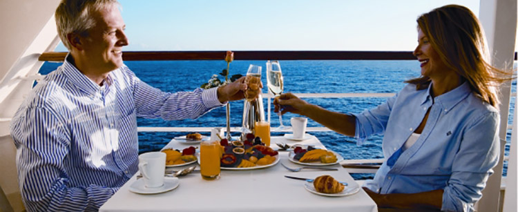 Couple enjoying breakfast on-board Azamara - Part of Le Club Voyage