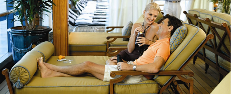 Couple relaxing on loungers